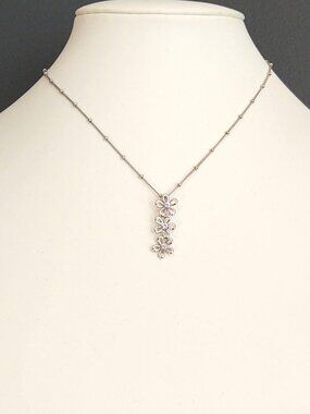 Silver flower pendant necklace with faux diamonds
